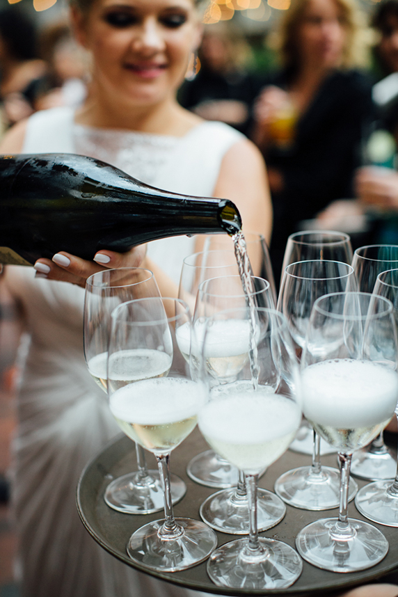 Colleen pouring champagne